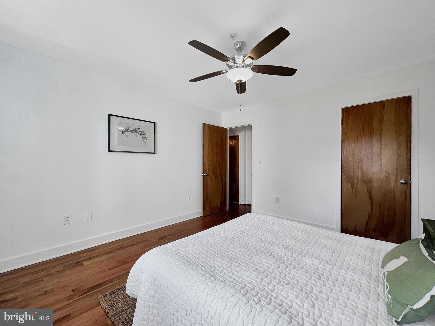 2615 4th Street Northeast, Unit 306 Washington, DC 20002 - Photo 8 of 13 a bedroom with a large bed and a chandelier