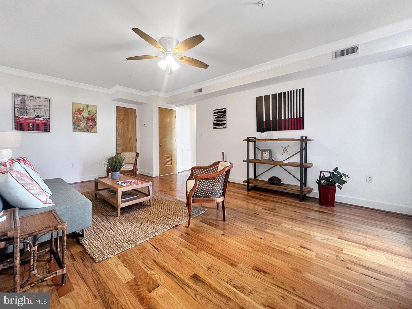 2615 4th Street Northeast, Unit 306 Washington, DC 20002 - Photo 9 of 13 a living room with furniture and a wooden floor