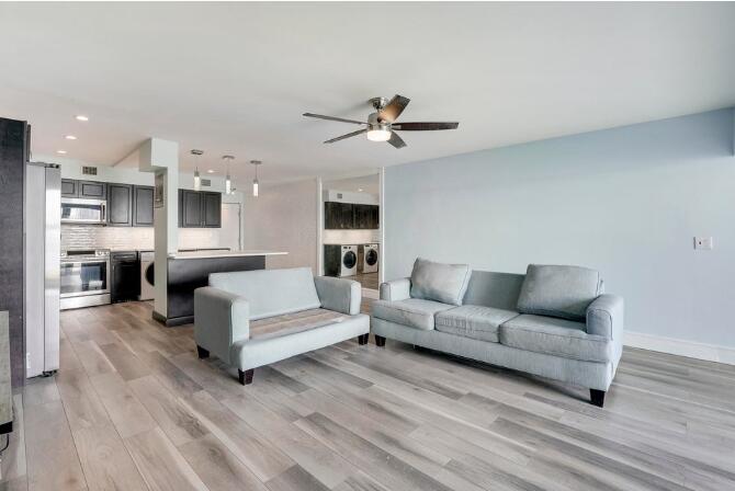 360 Wilma Circle, Unit 6 Riviera Beach, FL 33404 - Photo 5 of 13 a living room with furniture and a wooden floor