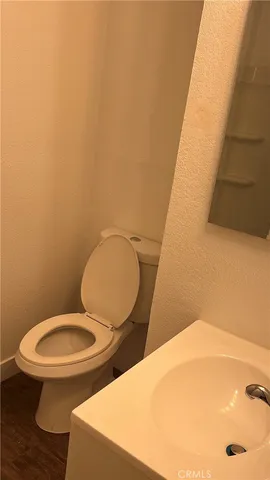 a bathroom with a toilet and a sink