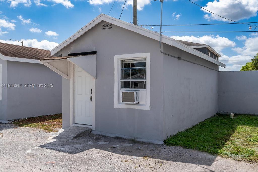 12101 Everglades Street, Unit 7 Canal Point, FL 33438 - Photo 2 of 2 a backyard of a house