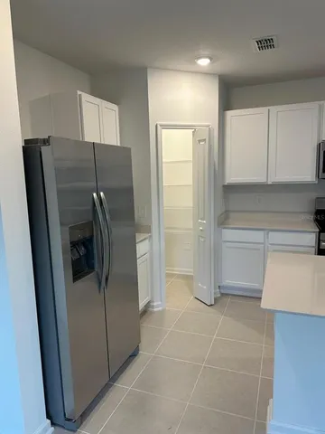 a kitchen with stainless steel appliances a refrigerator and a sink