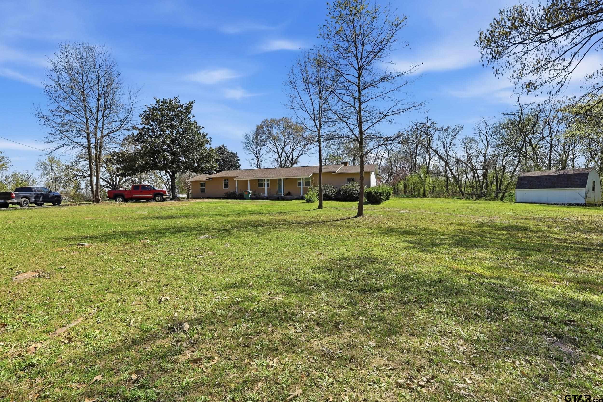 4932 Southeast Acc Road Mount Vernon, TX 75457 - Photo 1 of 35 a view of a grassy field with trees