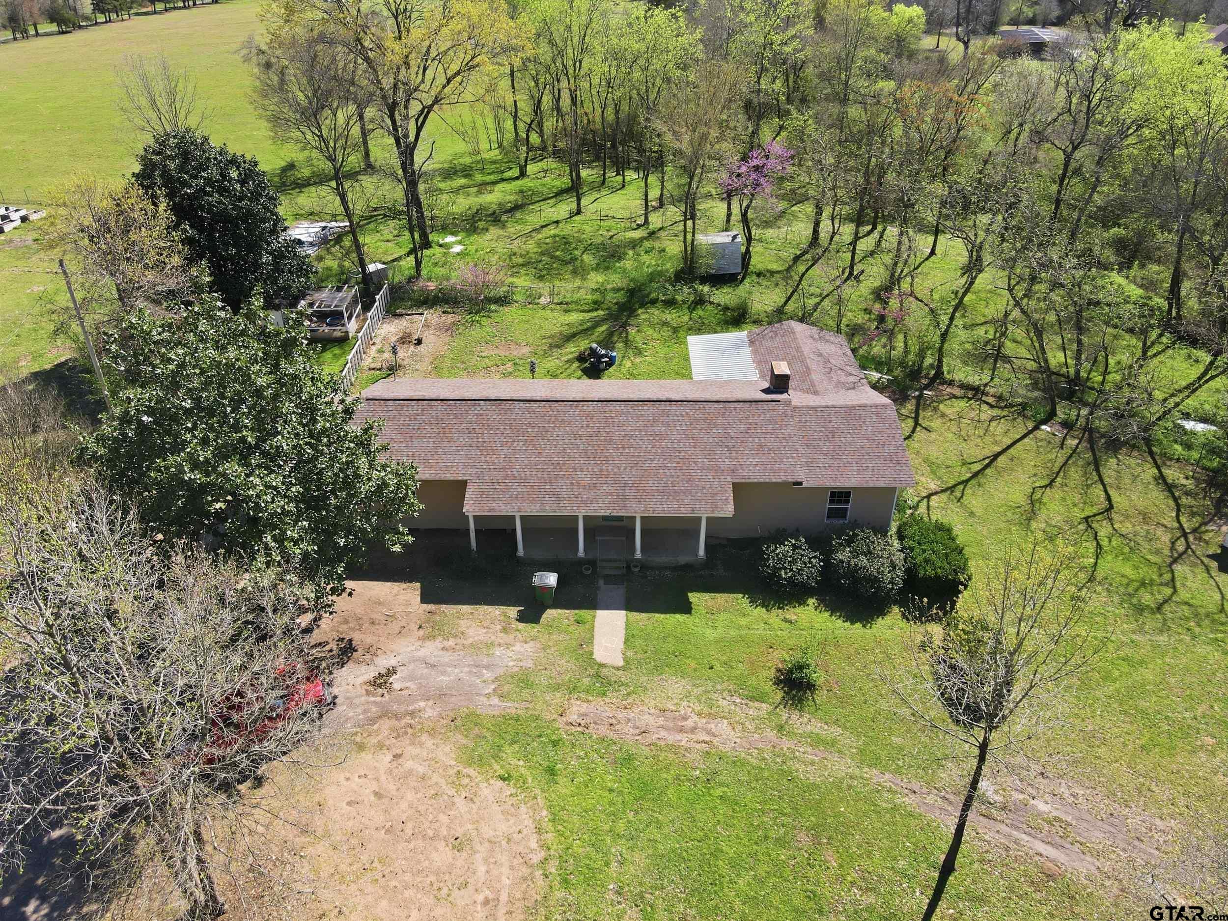 4932 Southeast Acc Road Mount Vernon, TX 75457 - Photo 29 of 35 a view of a house with a yard