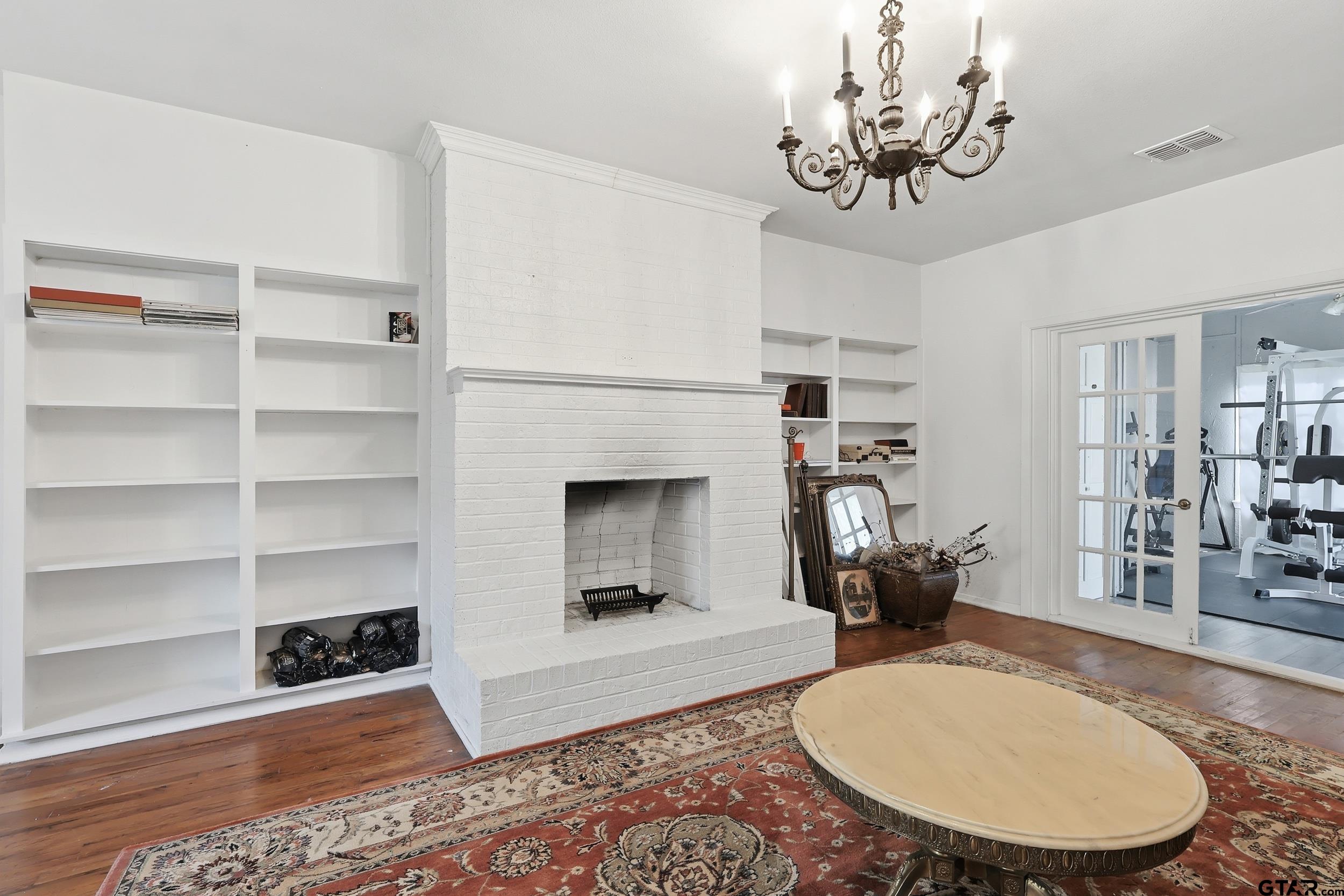 4932 Southeast Acc Road Mount Vernon, TX 75457 - Photo 7 of 35 a living room with furniture and a fireplace
