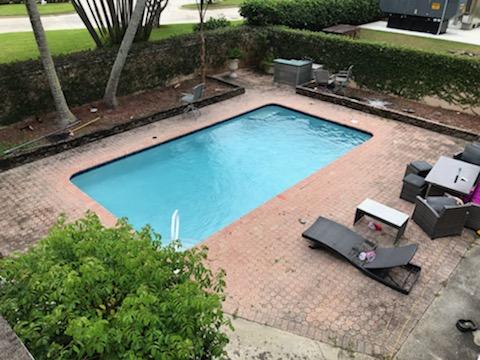 2628 Marcinski Road Jupiter, FL 33477 - Photo 13 of 18 a view of a yard with chairs