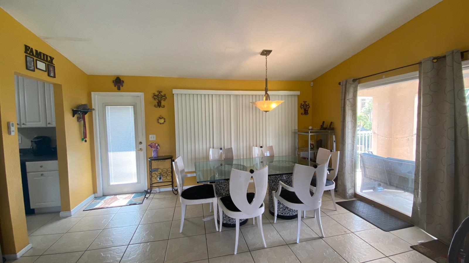 2628 Marcinski Road Jupiter, FL 33477 - Photo 4 of 18 a view of a dining room and furniture
