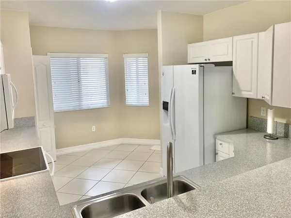a bathroom with a sink a toilet and a shower