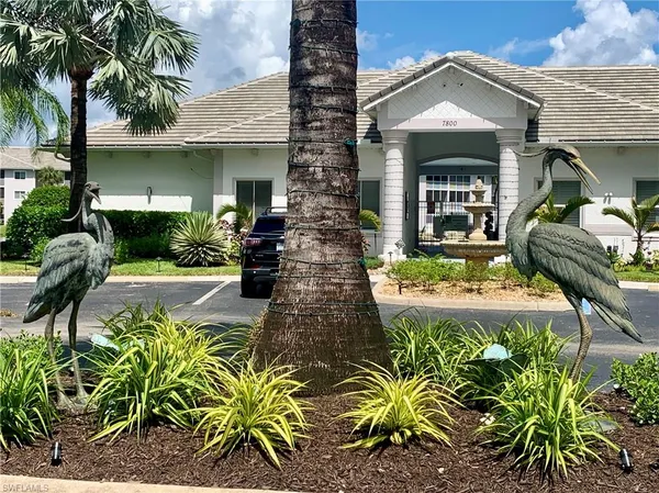 a view of swimming pool with outdoor seating and yard in back