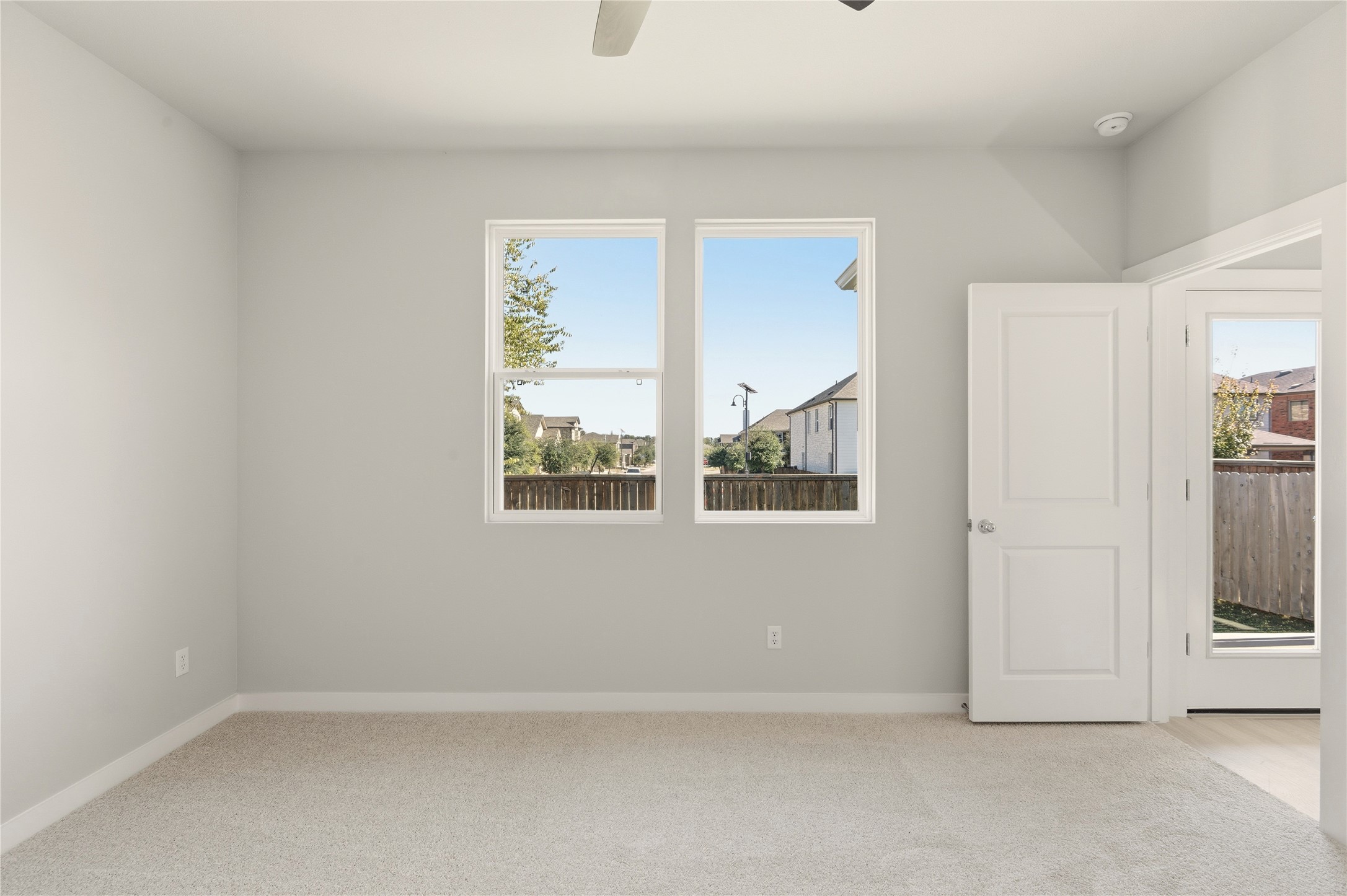 2201 Cento Walk Round Rock, TX 78664 - Photo 12 of 30 Spare room featuring light colored carpet and ceiling fan