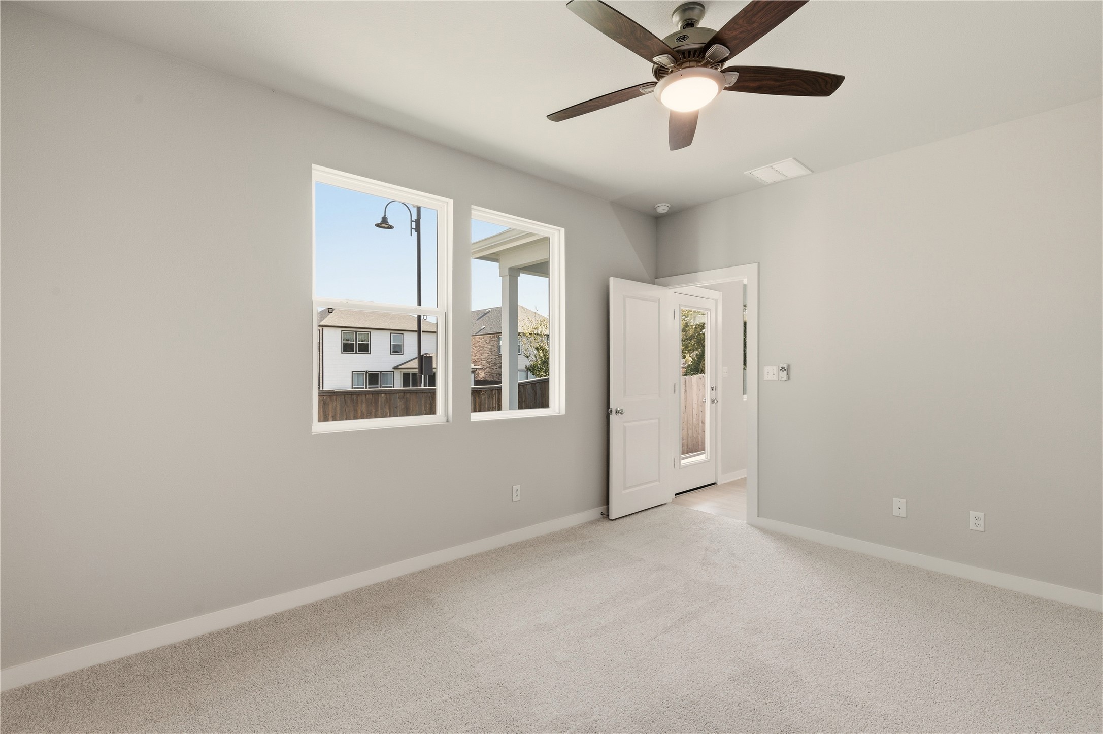 2201 Cento Walk Round Rock, TX 78664 - Photo 13 of 30 Unfurnished room with light colored carpet and a ceiling fan