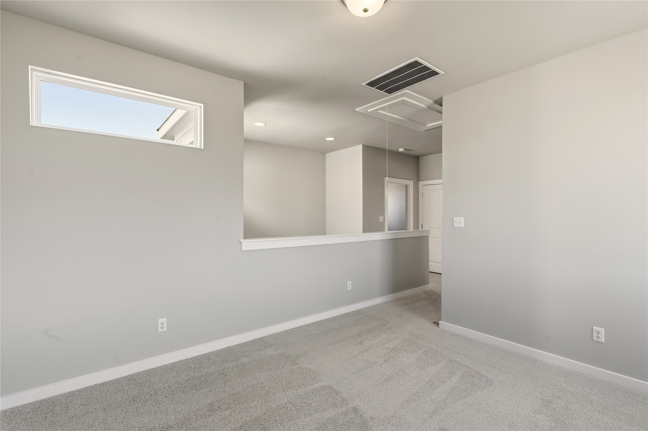 2201 Cento Walk Round Rock, TX 78664 - Photo 18 of 30 Unfurnished room featuring carpet, attic access, and recessed lighting