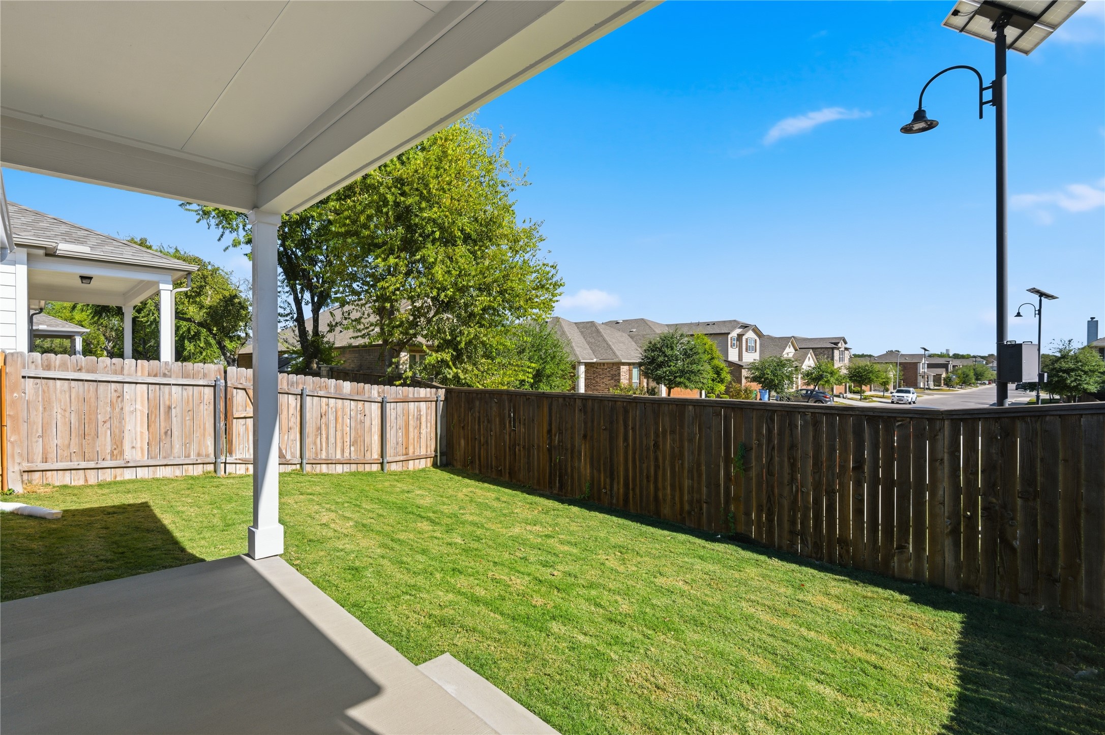 2201 Cento Walk Round Rock, TX 78664 - Photo 24 of 30 Fenced backyard featuring a patio area and a residential view