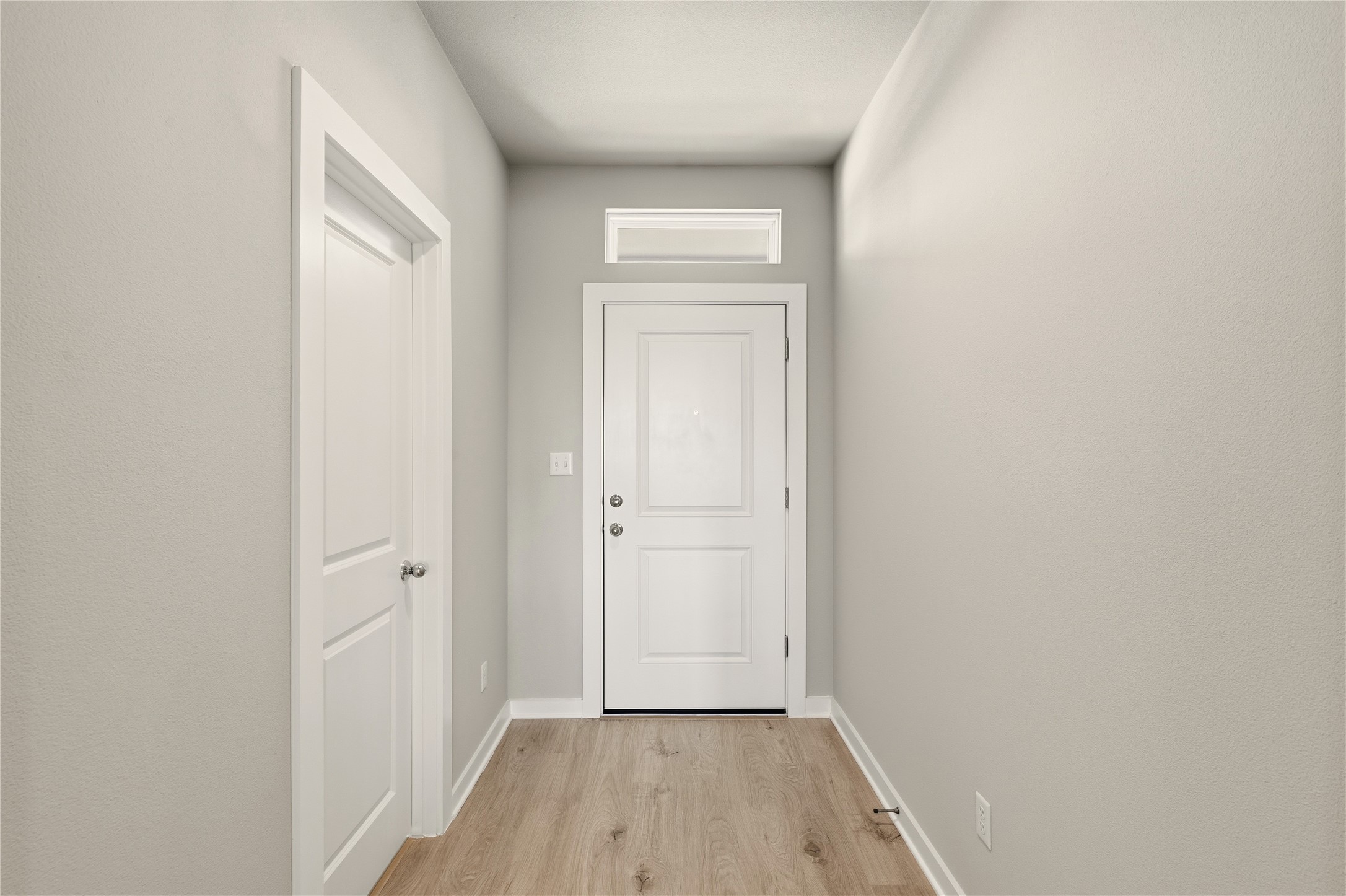 2201 Cento Walk Round Rock, TX 78664 - Photo 3 of 30 Entryway featuring wood finished floors and baseboards