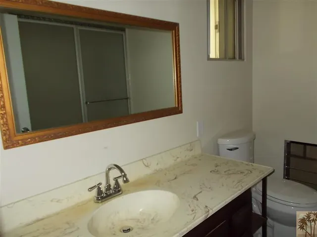 a bathroom with a glass door