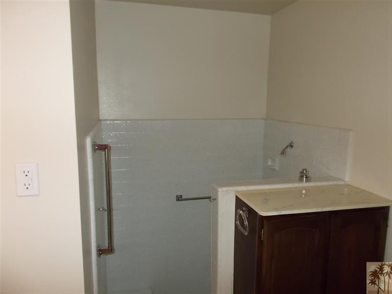 12478 Redbud Road Desert Hot Springs, CA 92240 - Photo 15 of 21 a bathroom with a sink and a mirror