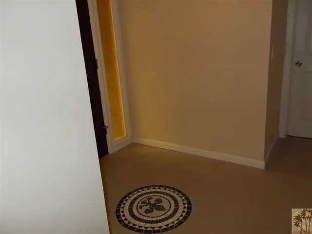 a view of room with a ceiling fan