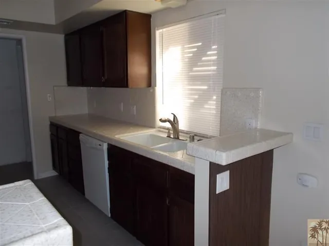 a kitchen with a sink and a window