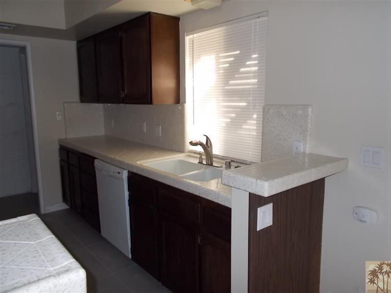 12478 Redbud Road Desert Hot Springs, CA 92240 - Photo 5 of 21 a kitchen with a sink and a window