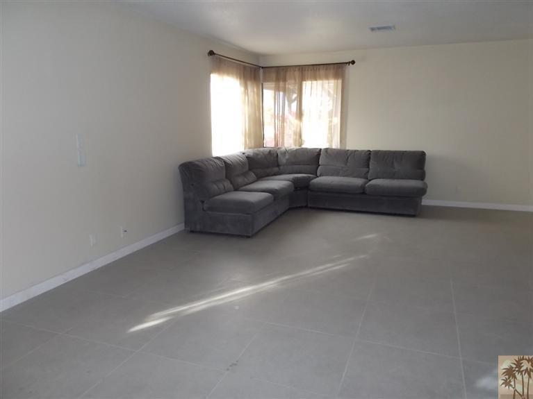 12478 Redbud Road Desert Hot Springs, CA 92240 - Photo 9 of 21 a living room with furniture and windows