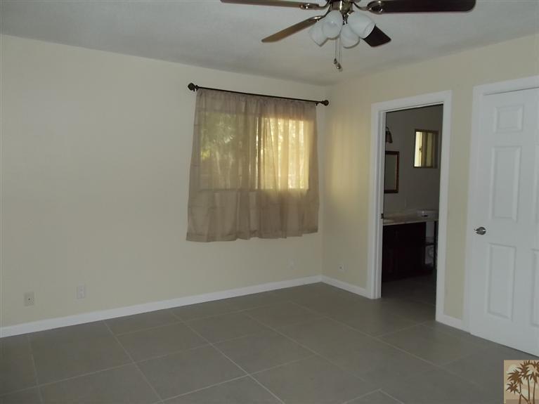 12478 Redbud Road Desert Hot Springs, CA 92240 - Photo 10 of 21 a view of an empty room with a window