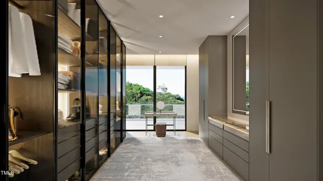 a view of a hallway with floor to ceiling window and couch