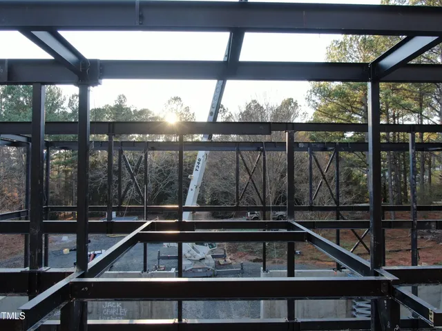 a view of a balcony with wooden floor