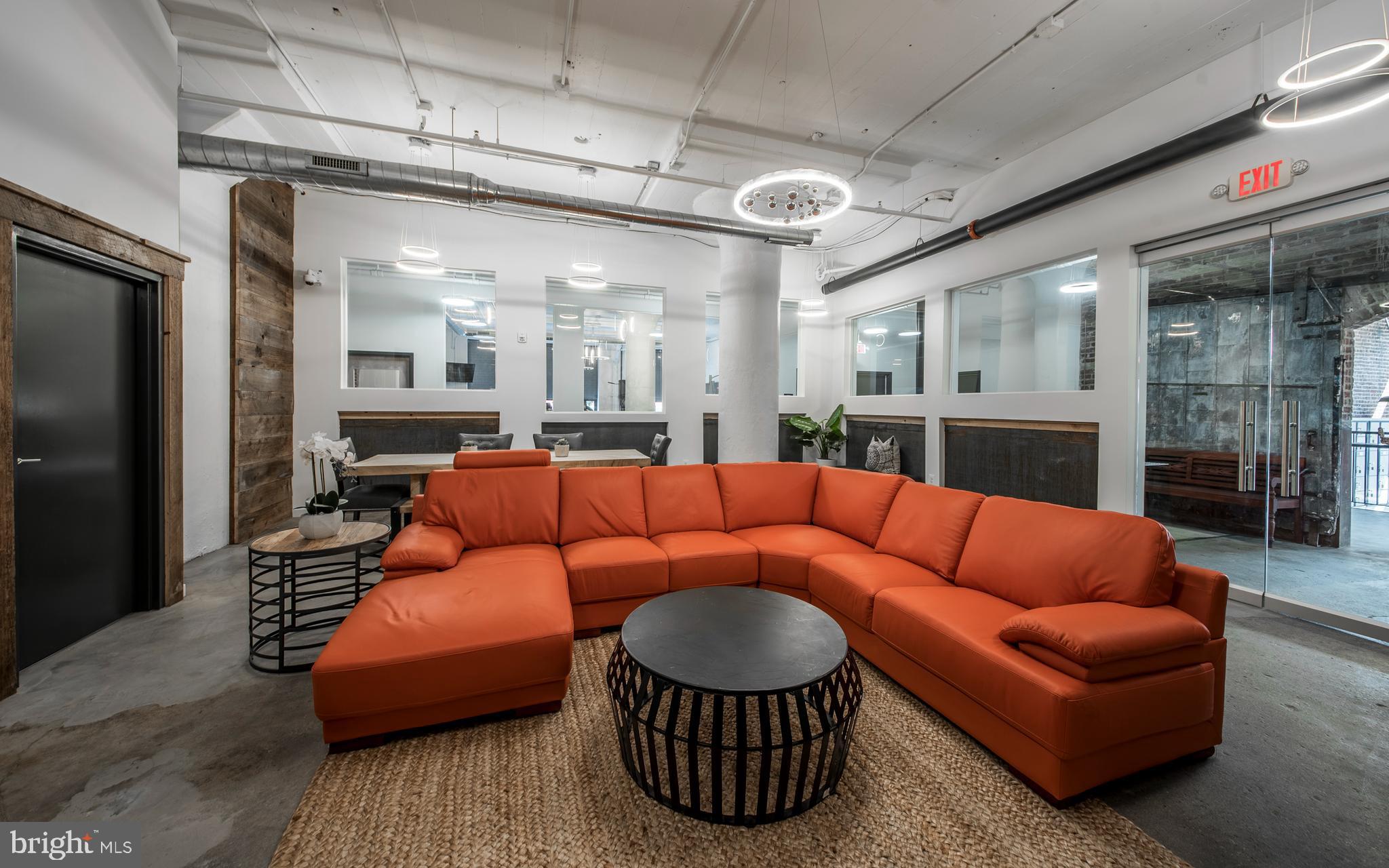 1201 Jackson Street, Unit 521 Philadelphia, PA 19148 - Photo 27 of 42 a living room with furniture a ceiling fan and a rug