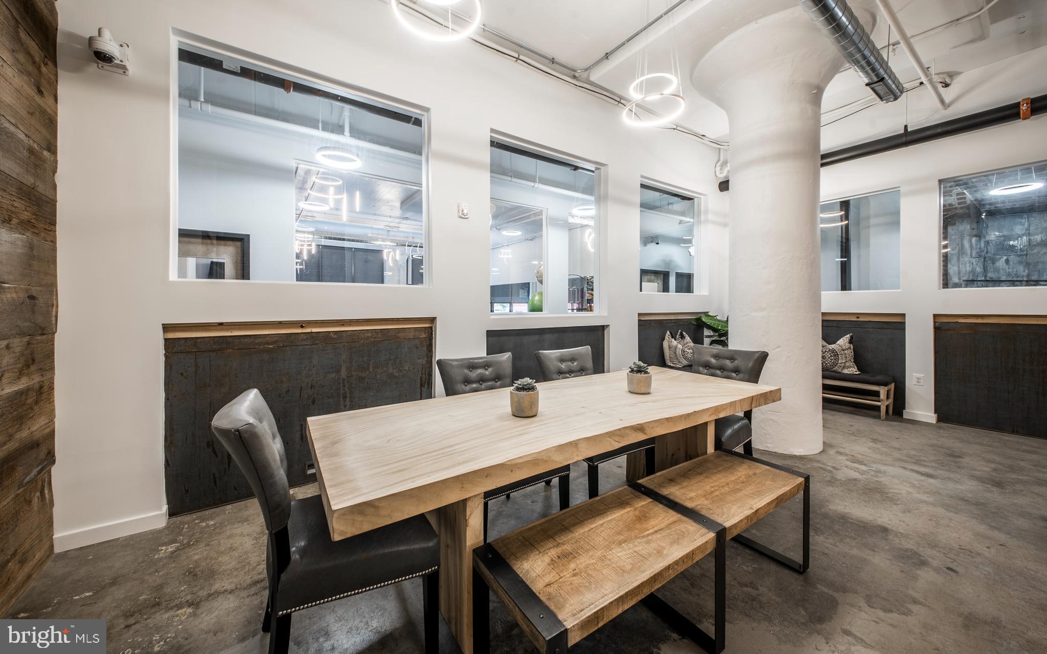 1201 Jackson Street, Unit 521 Philadelphia, PA 19148 - Photo 28 of 42 a view of a dining room with furniture window and wooden floor