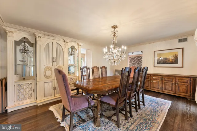 a kitchen with stainless steel appliances kitchen island granite countertop a refrigerator a stove a sink dishwasher with a dining table and chairs