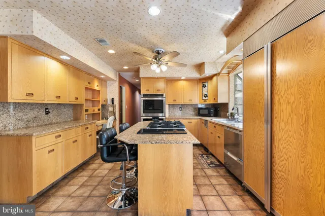 a bed room with a bed and a large mirror