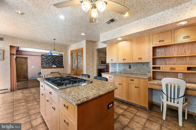 a view of a livingroom with a fireplace and a window