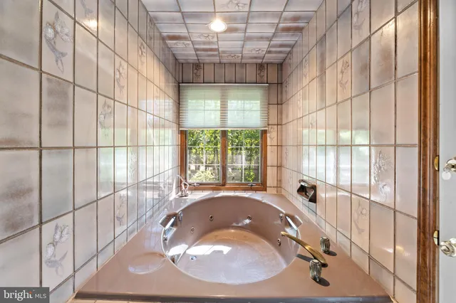 a view of house with yard and entertaining space