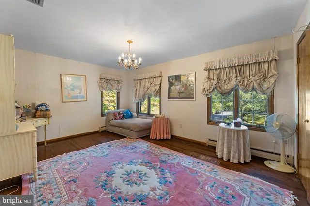 a view of entryway with wooden floor and stairs