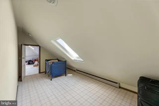 an aerial view of a houses with a yard