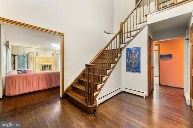 a view of an entryway with wooden floor