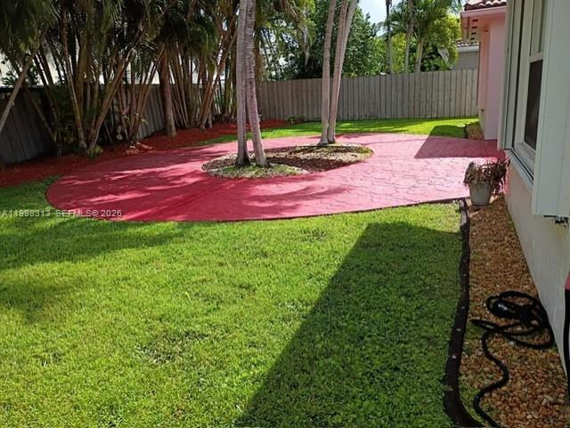 15761 Southwest 148th Terrace Miami, FL 33196 - Photo 17 of 17 a view of a backyard with a house