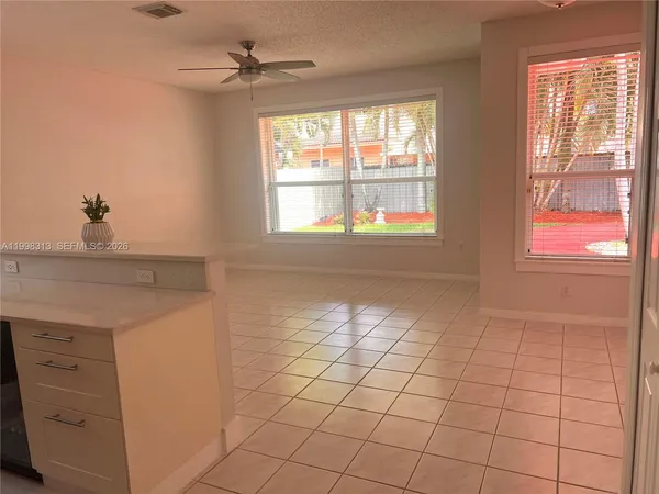 a view of an empty room and window