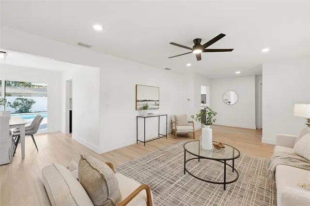a living room with furniture and white walls