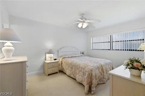 a bed room with a bed and a table