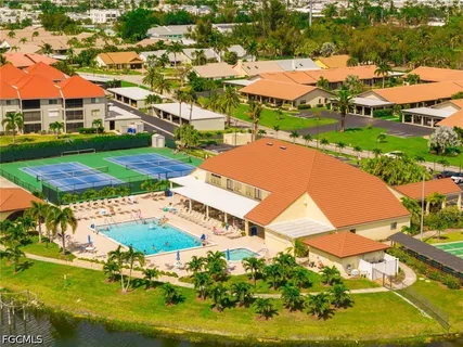 an aerial view of residential houses with yard