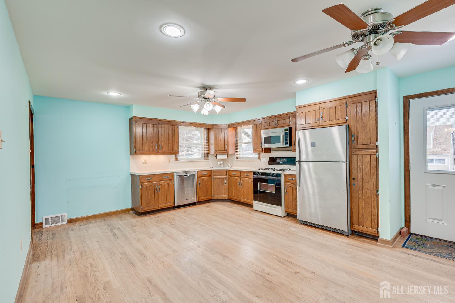 20 Longfield Road New Brunswick, NJ 08901 - Photo 12 of 32 a large kitchen with a refrigerator a sink dishwasher a stove and a refrigerator