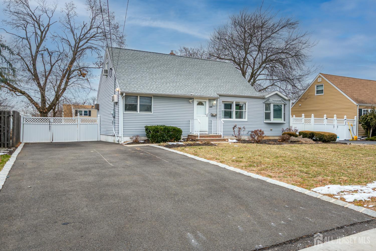20 Longfield Road New Brunswick, NJ 08901 - Photo 2 of 32 a front view of house with yard and trees around