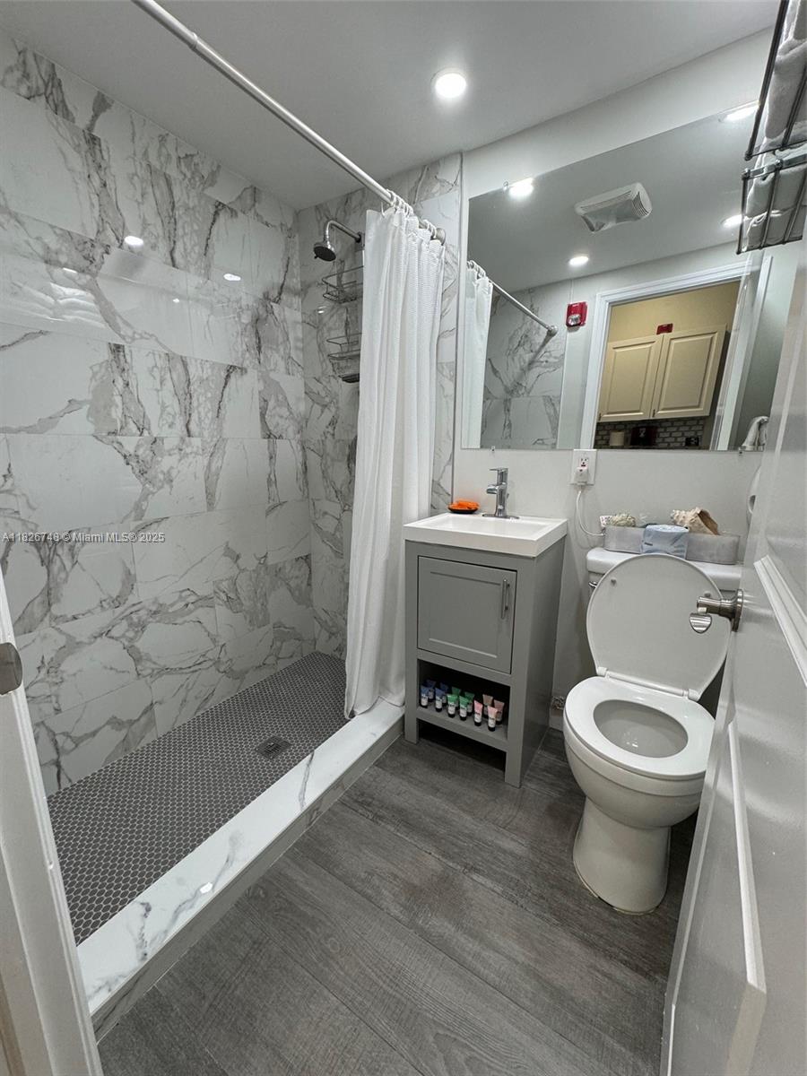 Flamingo-Lummus Miami Beach, FL 33139 - Photo 7 of 16 a bathroom with a sink toilet and shower