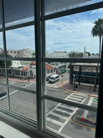 a large white bed in a white room