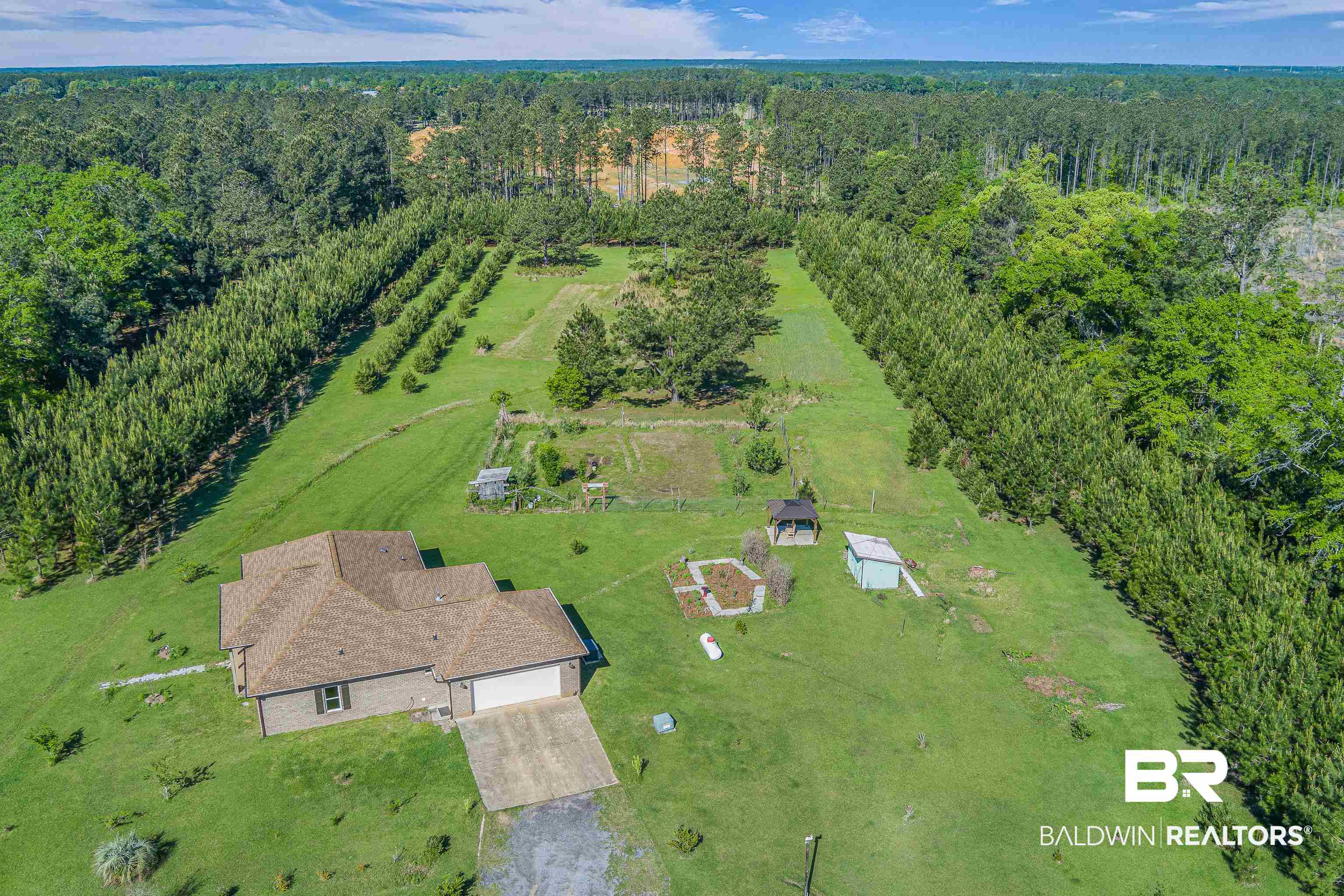 18255 Cactus Court Elberta, AL 36530 - Photo 52 of 53 View of subject property with a heavily wooded area