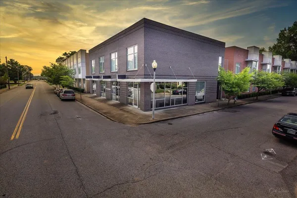 a front view of a house with parking space