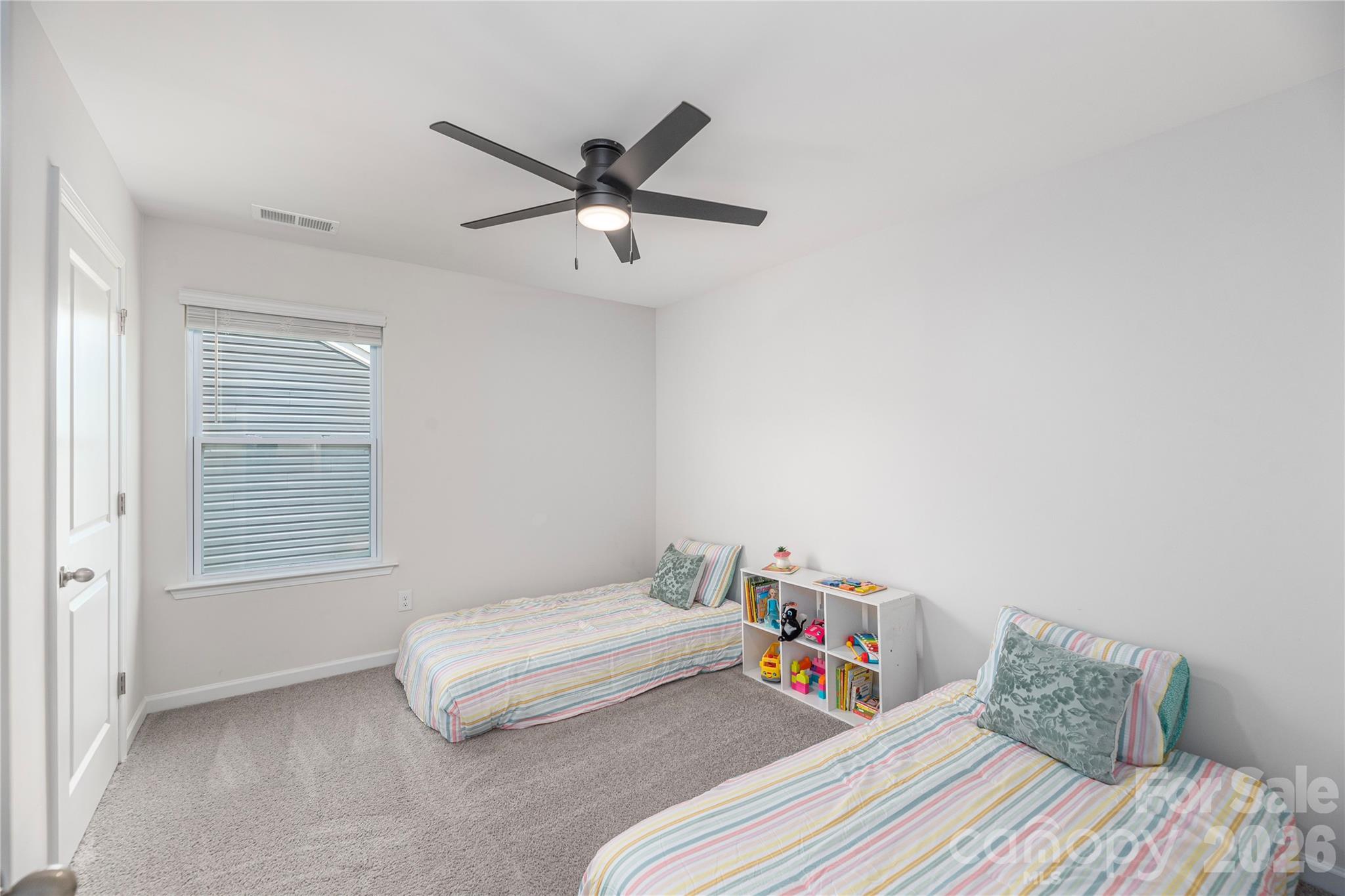 8 Madelyn Drive Clyde, NC 28721 - Photo 26 of 43 a bedroom with a bed and a chandelier