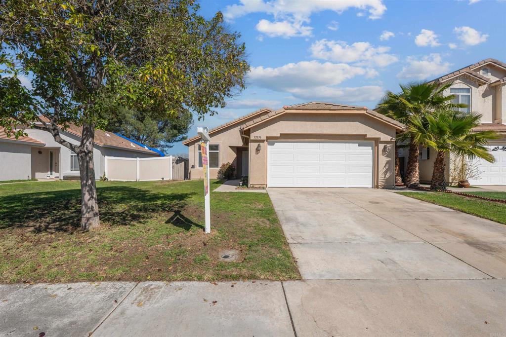 32836 Tulley Ranch Road Temecula, CA 92592 - Photo 1 of 1 a front view of a house with a yard and garage
