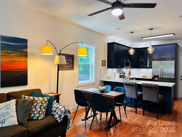 a view of kitchen and dining room with furniture